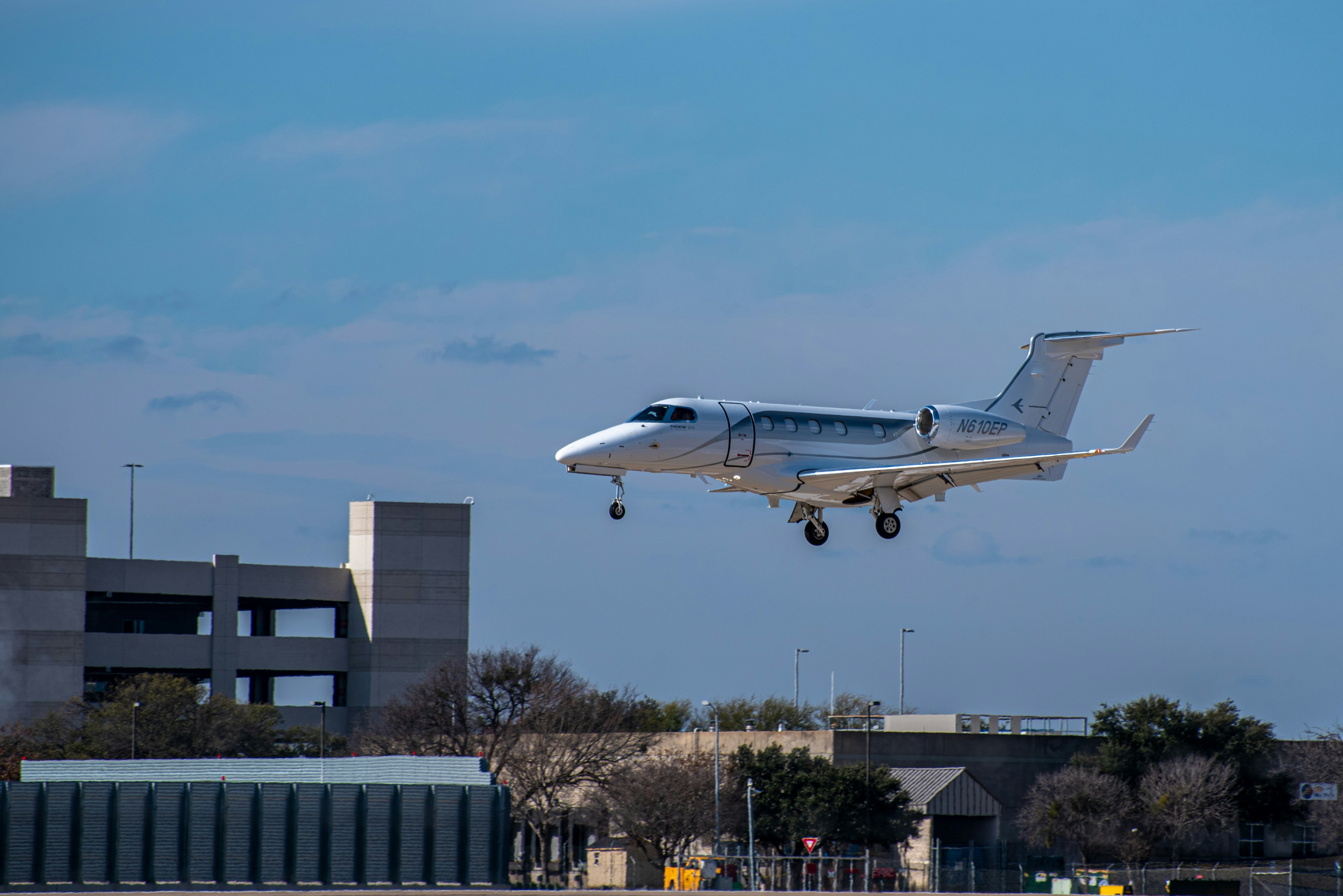 white and blue passenger plane in the sky during daytime